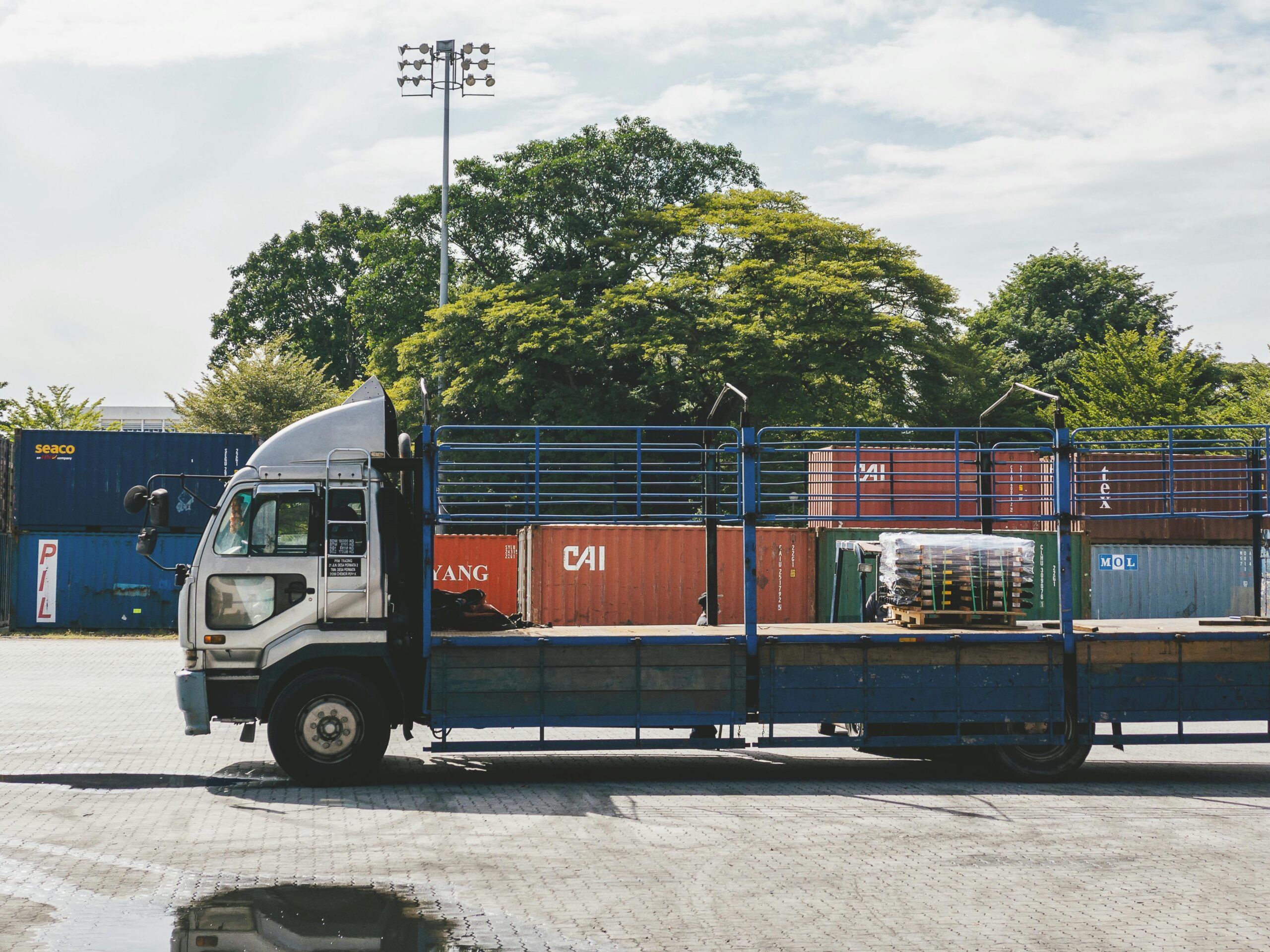 Veena Packers & Movers Navi Mumbai insured moving truck transporting household goods in Mumbai